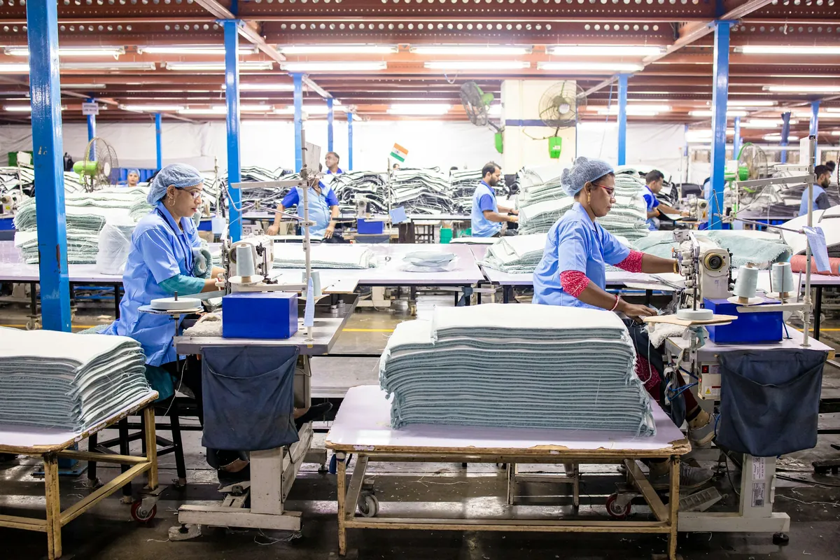 Workers at a textile production line
