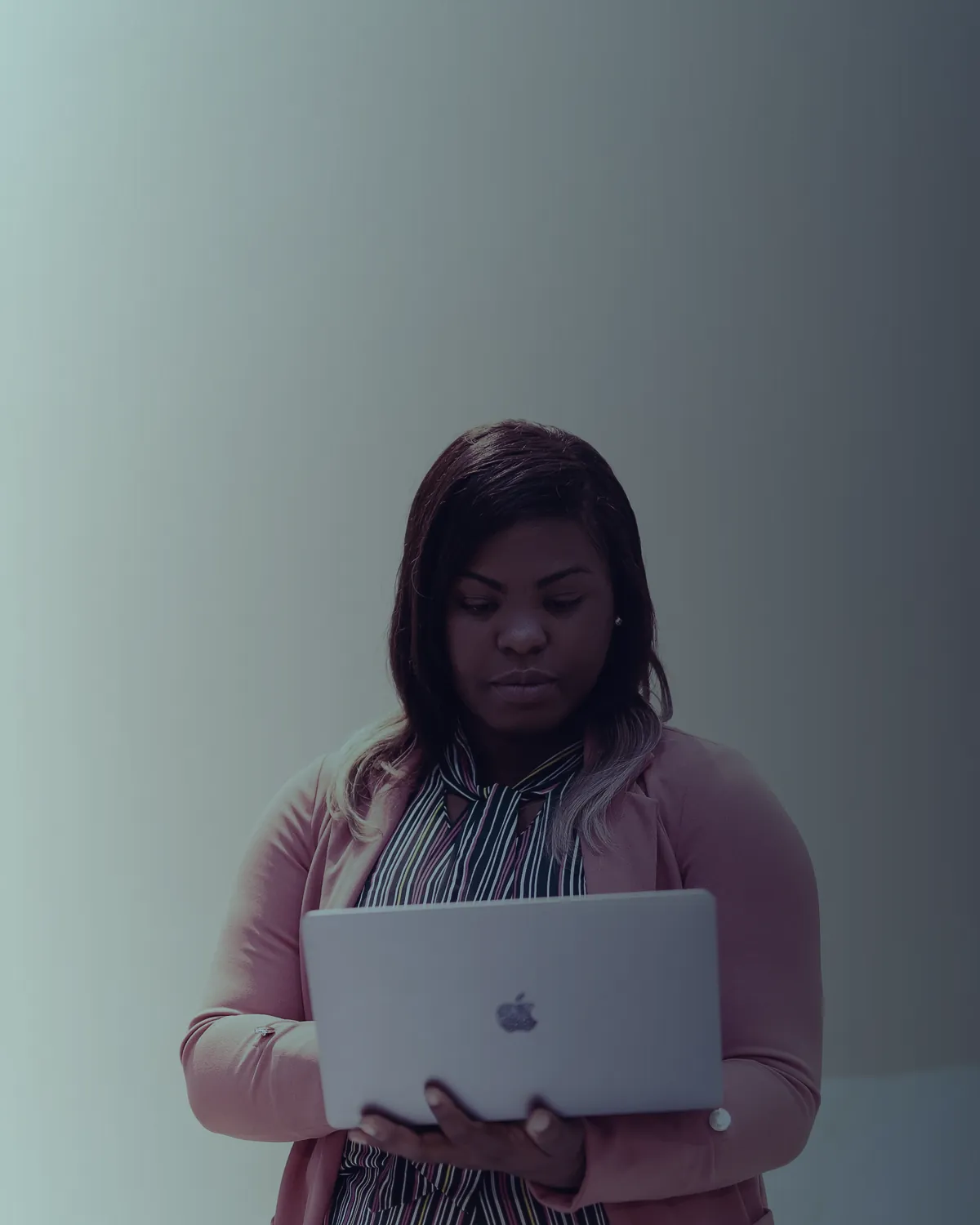 Woman reading on a laptop