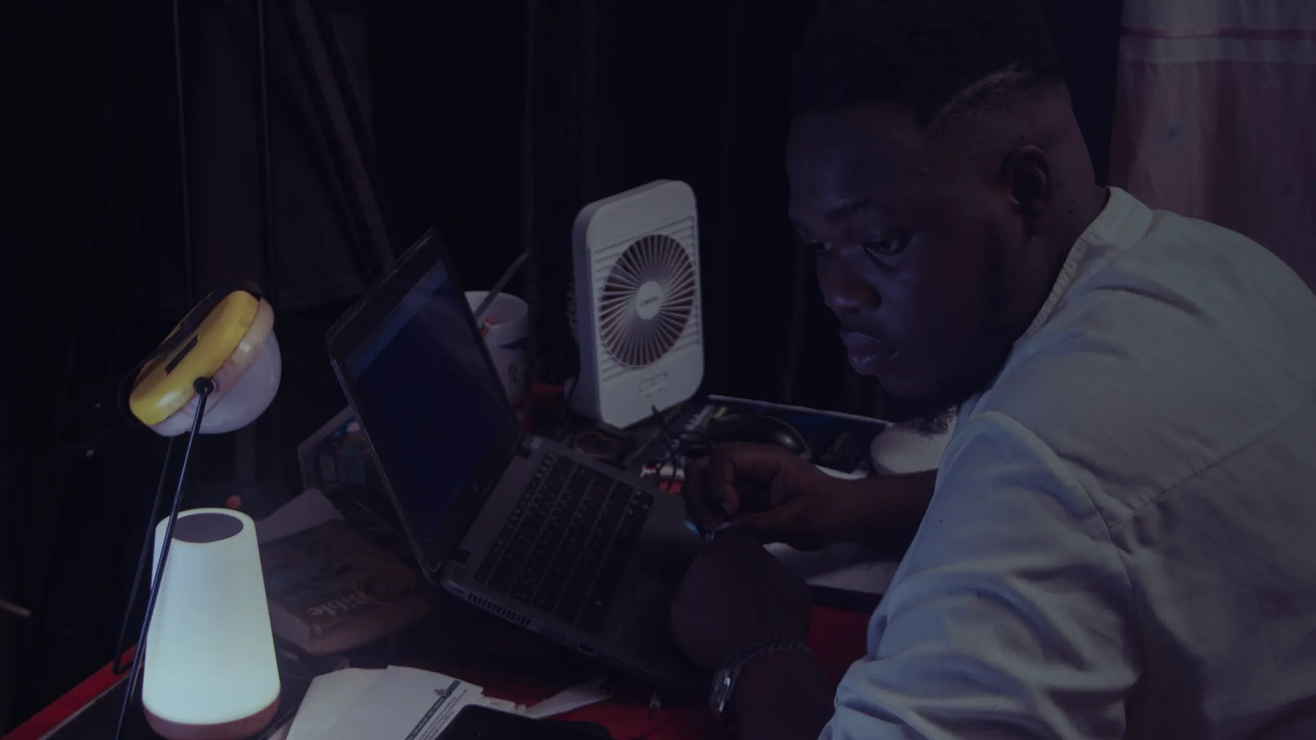 Engineer working late at a laptop