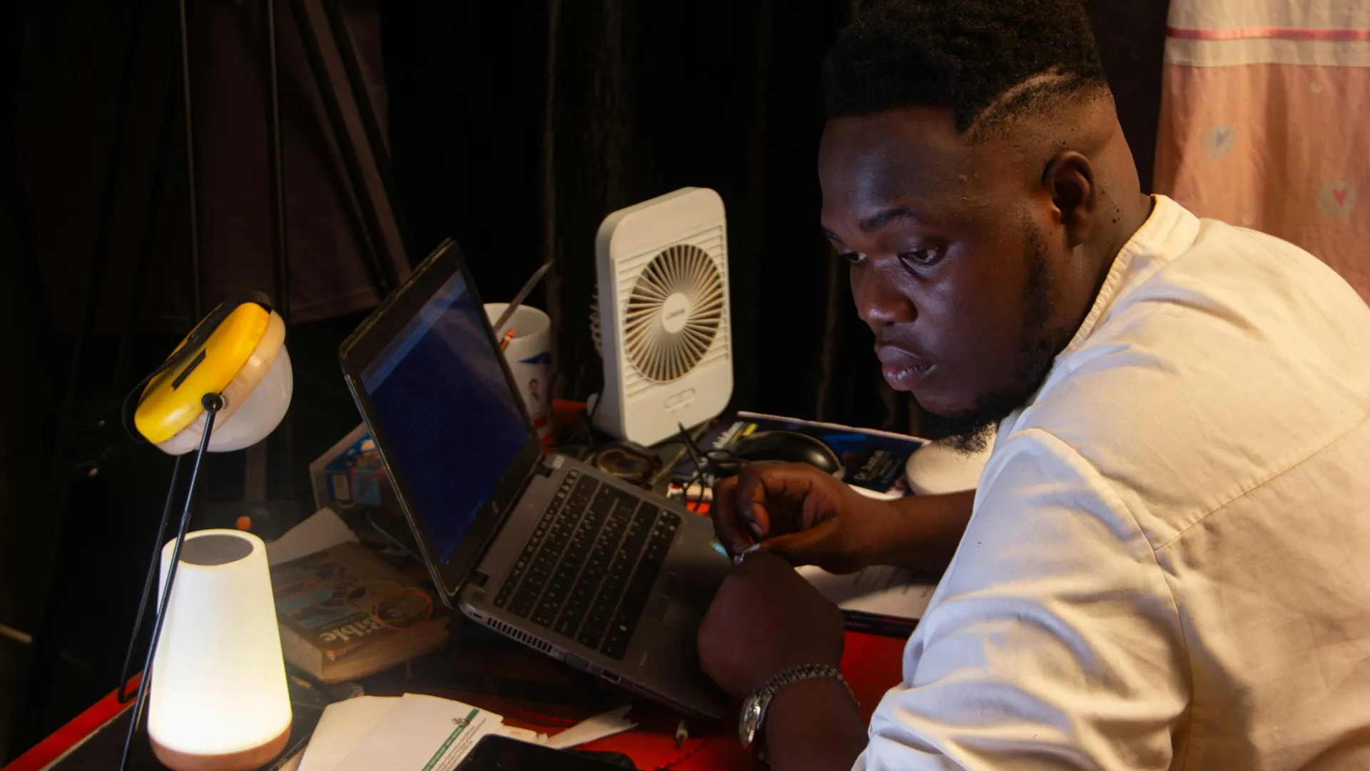 Engineer working late at a laptop