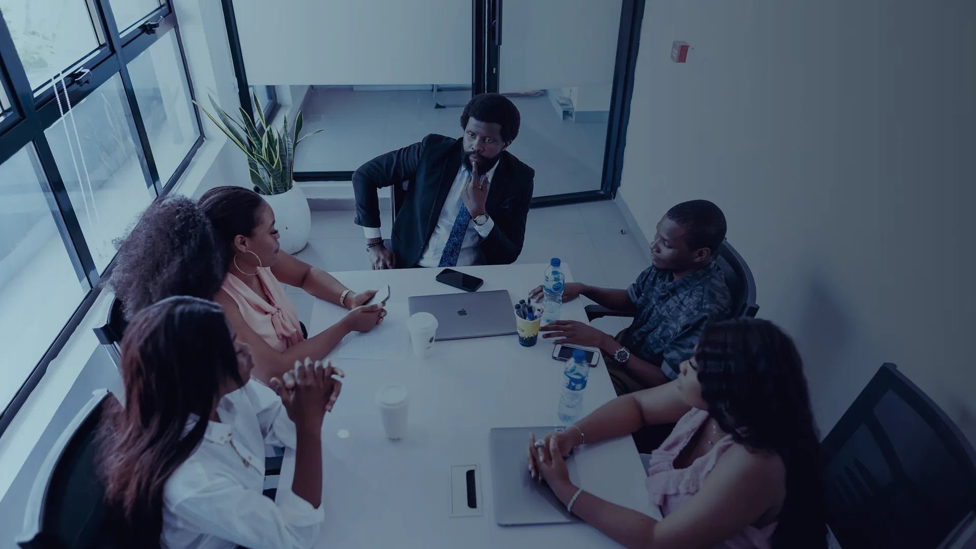 Team meeting around a white table